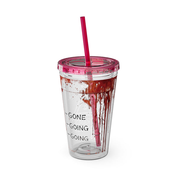 Clear tumbler with red liquid and text, pink lid and straw on a white background