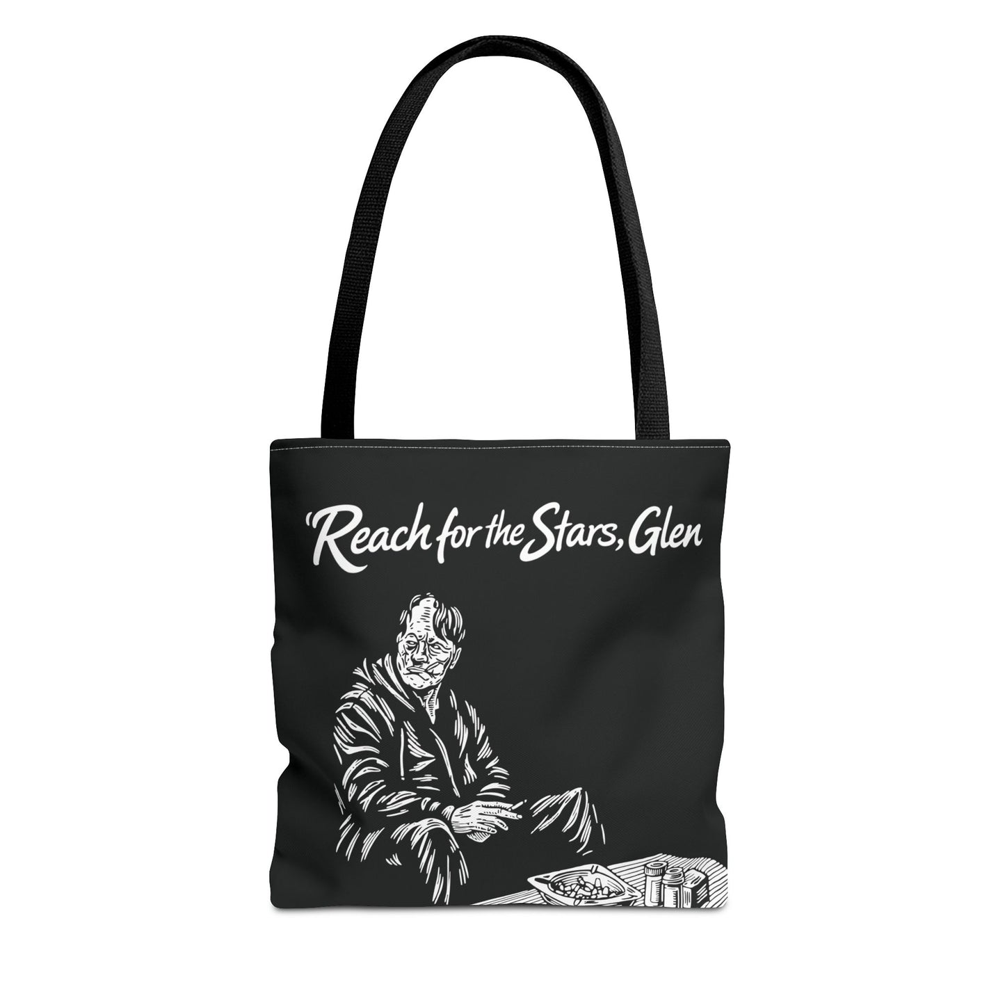 Black tote bag with white graphic and text 'Reach for the Stars, Glen' on a white background
